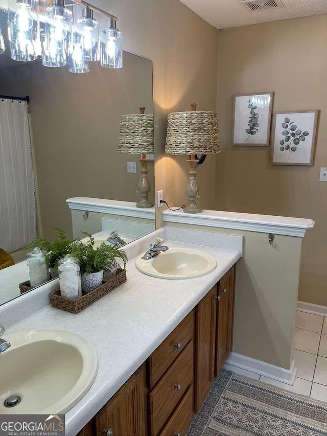 bathroom with vanity and tile patterned floors