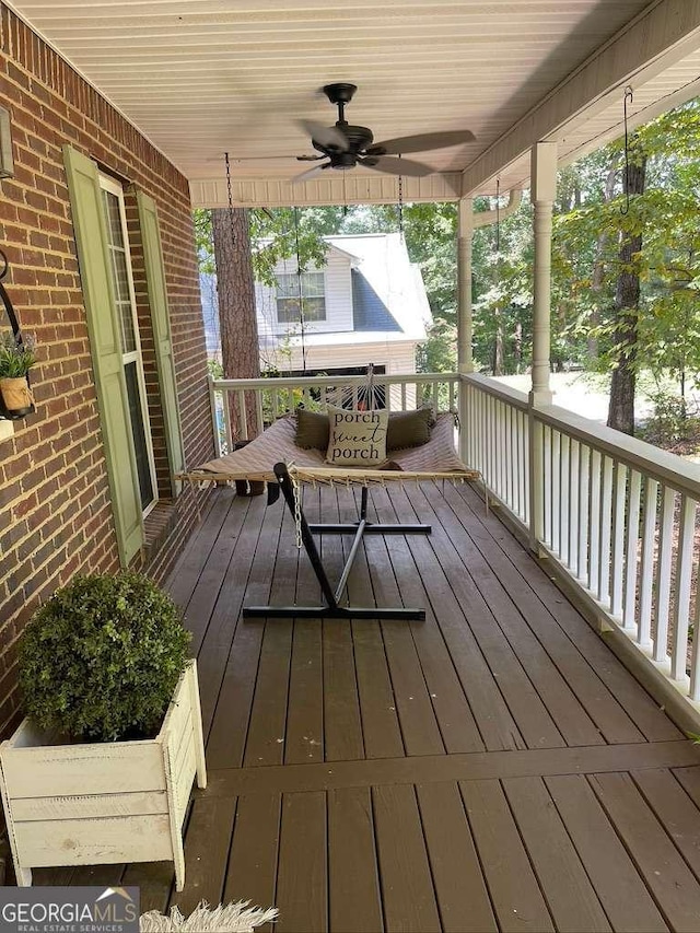 deck featuring ceiling fan and a porch