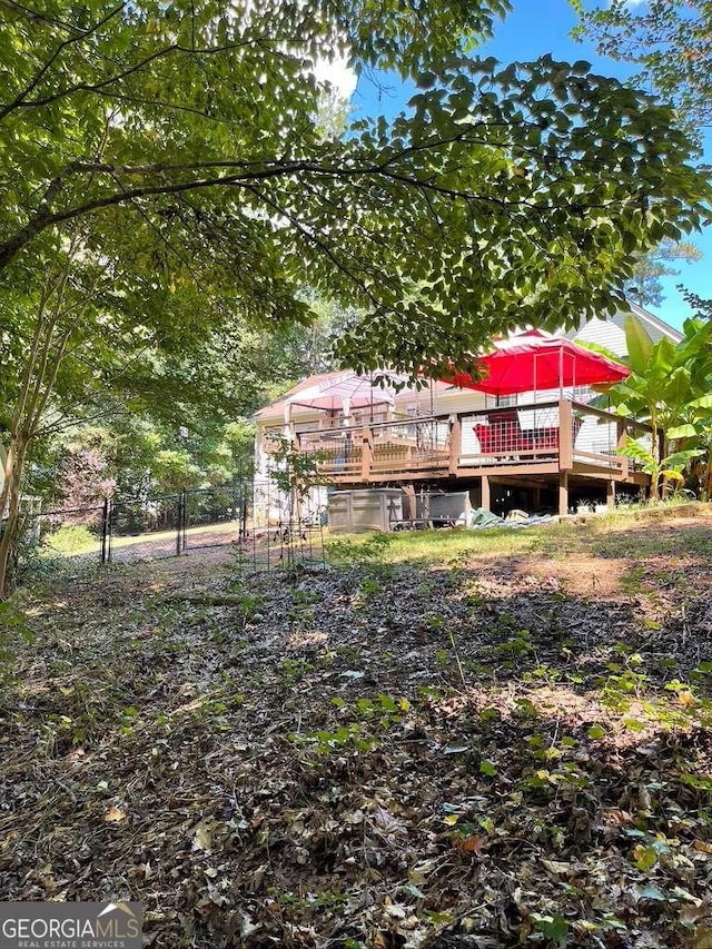 back of house with a wooden deck