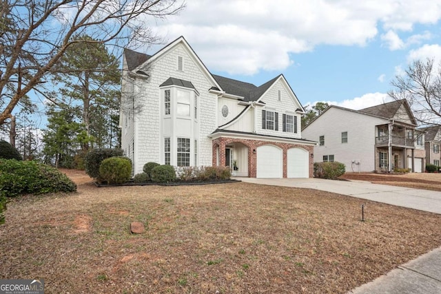 view of front property with a garage and a front lawn