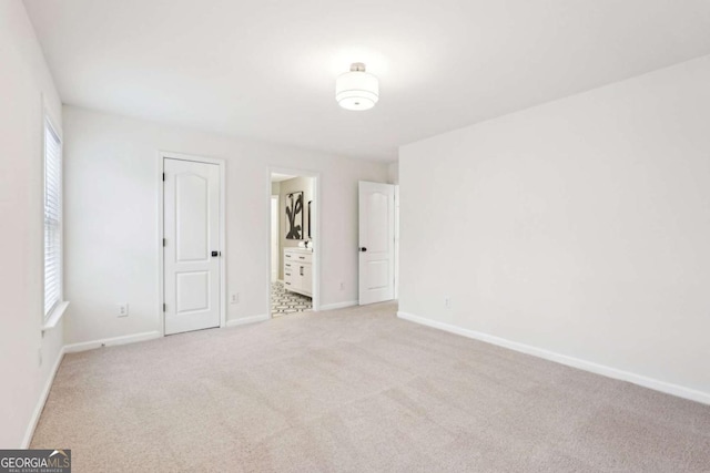 spare room with light carpet