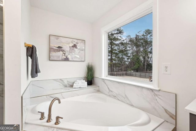 bathroom with a washtub