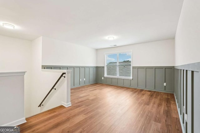 unfurnished room featuring light hardwood / wood-style flooring