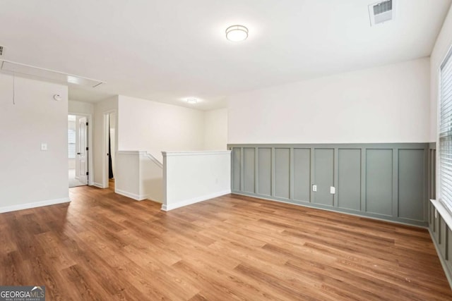 unfurnished room featuring light hardwood / wood-style flooring