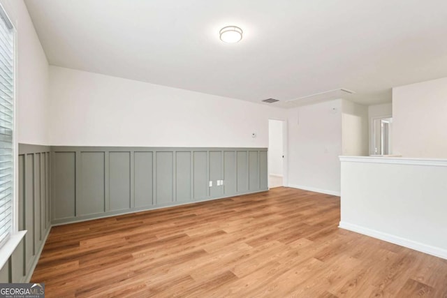 unfurnished room with light hardwood / wood-style flooring