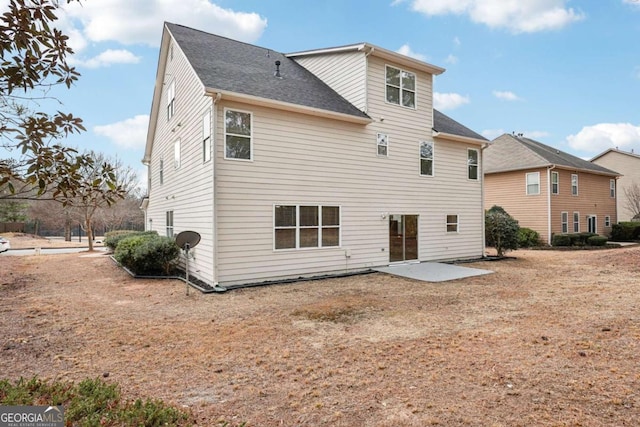 rear view of house with a patio