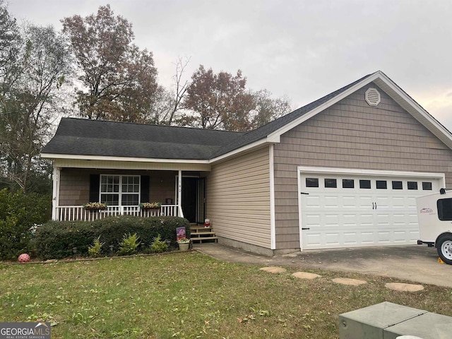 single story home featuring a garage, a front lawn, and a porch