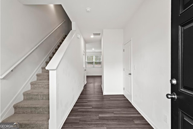 entryway featuring dark wood-type flooring