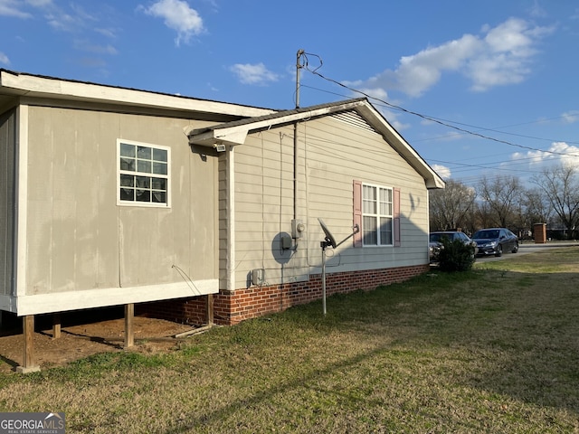 view of property exterior with a lawn