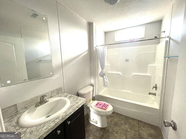 full bathroom with tile patterned flooring, vanity, toilet, shower / bath combo, and a textured ceiling