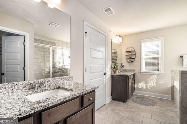 bathroom featuring vanity and separate shower and tub