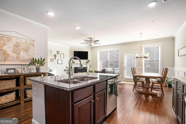 kitchen with sink, dark wood-type flooring, dishwasher, dark brown cabinets, and light stone countertops