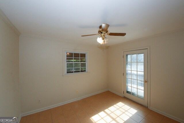 unfurnished room with ceiling fan and ornamental molding