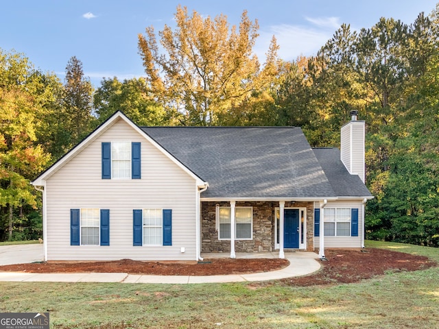 view of front facade with a front yard and a porch