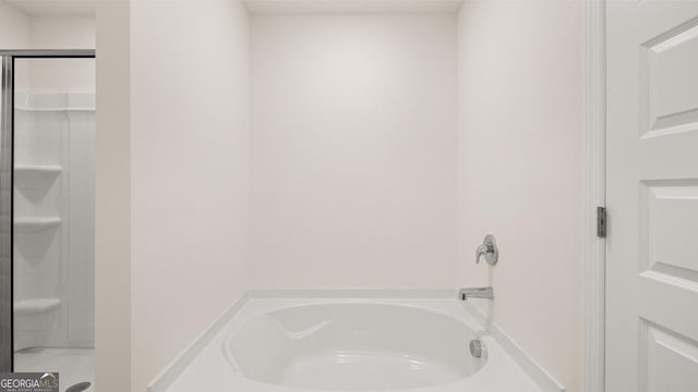 bathroom with separate shower and tub