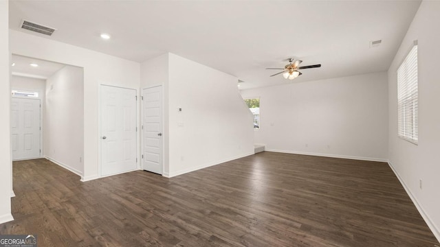 empty room featuring ceiling fan and dark hardwood / wood-style flooring