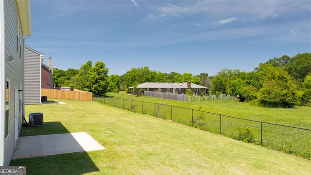 view of yard with a patio and central air condition unit