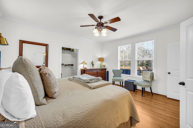 bedroom featuring crown molding, ceiling fan, and hardwood / wood-style floors