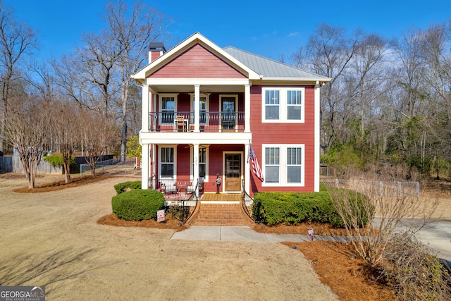 view of front of property with a balcony and a porch