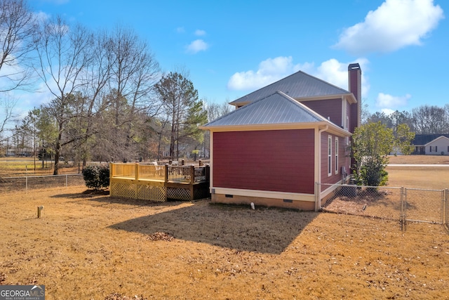 view of property exterior featuring a deck