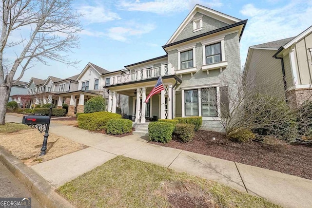 view of front of property with a balcony