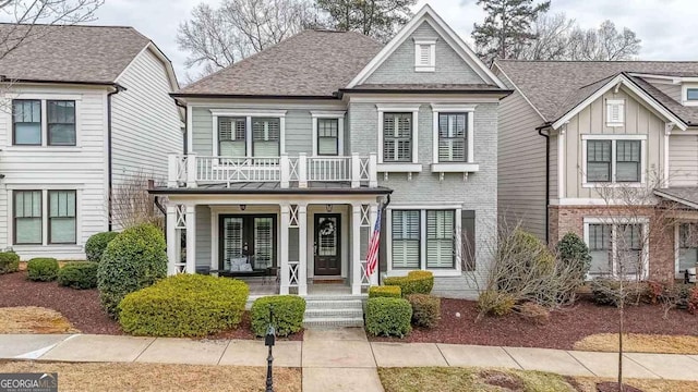 view of front of home with a balcony and covered porch