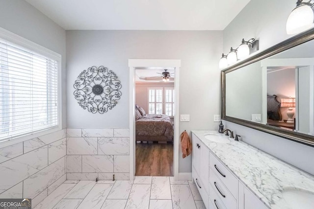 bathroom with ceiling fan and vanity