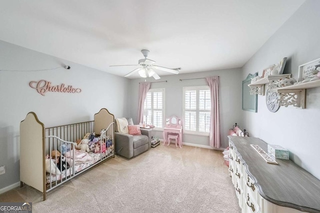 bedroom featuring light colored carpet and ceiling fan