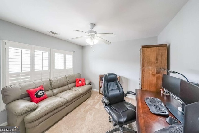 carpeted office with ceiling fan