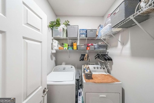 washroom with washer and dryer