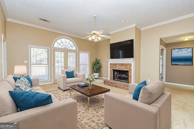 carpeted living room with crown molding, ceiling fan, and a brick fireplace