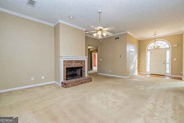 unfurnished living room featuring ornamental molding, light carpet, ceiling fan, and a fireplace