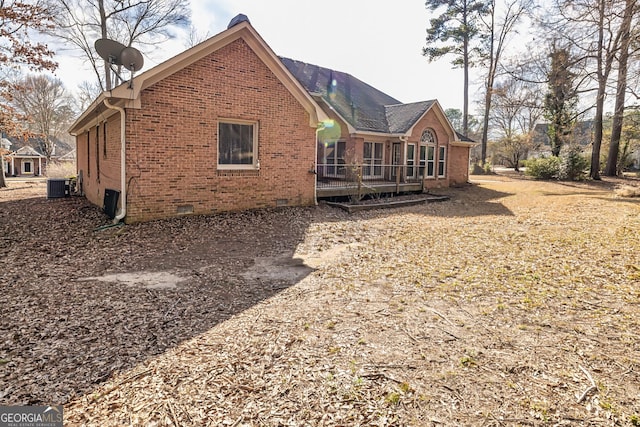 back of property featuring central AC unit