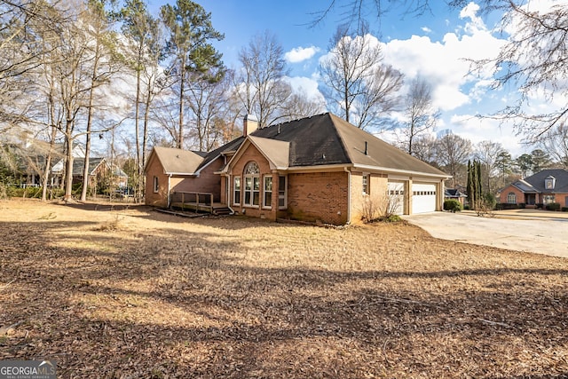 view of side of property with a garage