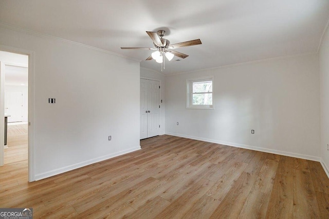 unfurnished room featuring crown molding, ceiling fan, and light hardwood / wood-style floors