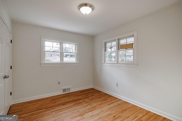 unfurnished room featuring light hardwood / wood-style floors