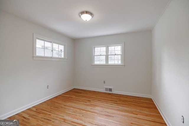 unfurnished room featuring light hardwood / wood-style floors