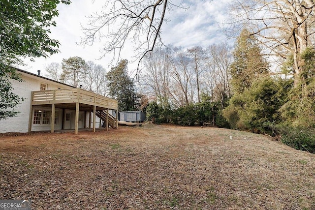 view of yard with a wooden deck