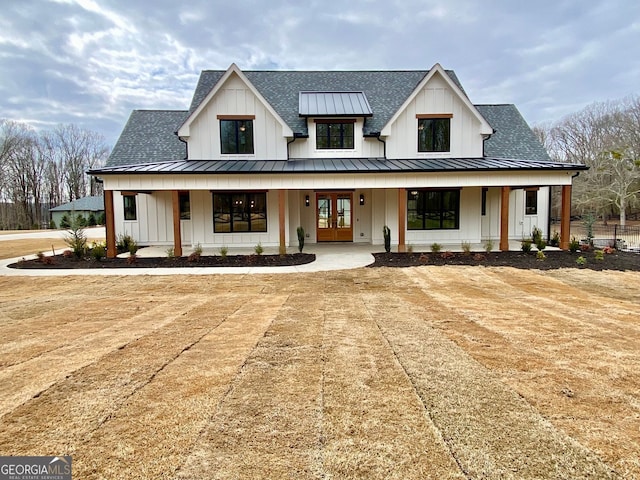 modern farmhouse with french doors and covered porch