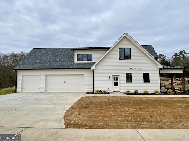 view of front of house with a garage and a front yard