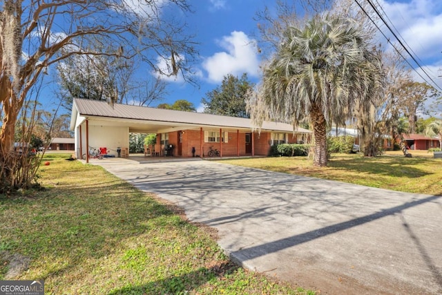 ranch-style home with a carport and a front yard