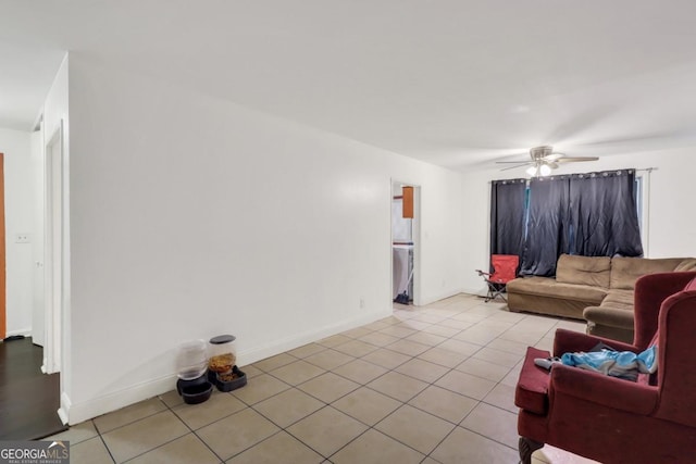 tiled living room featuring ceiling fan