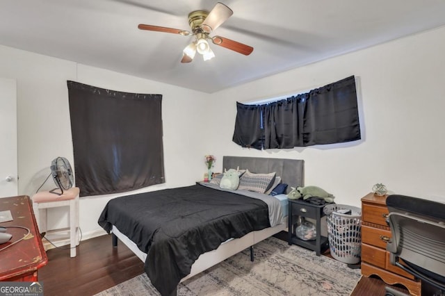 bedroom featuring hardwood / wood-style floors and ceiling fan