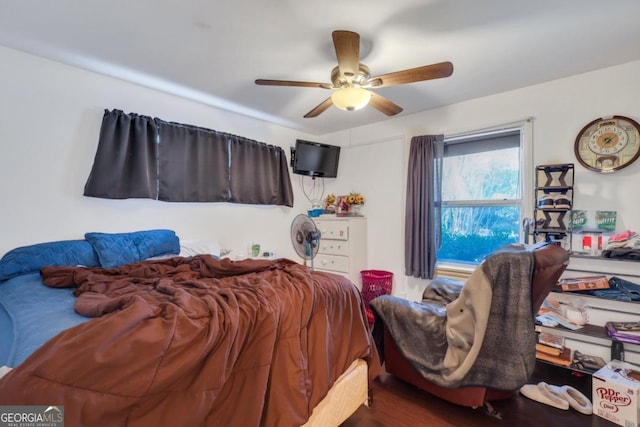 bedroom featuring wood-type flooring and ceiling fan