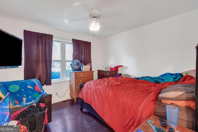 bedroom featuring dark wood-type flooring and ceiling fan