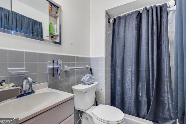 bathroom featuring vanity, tile walls, toilet, and a shower with shower curtain