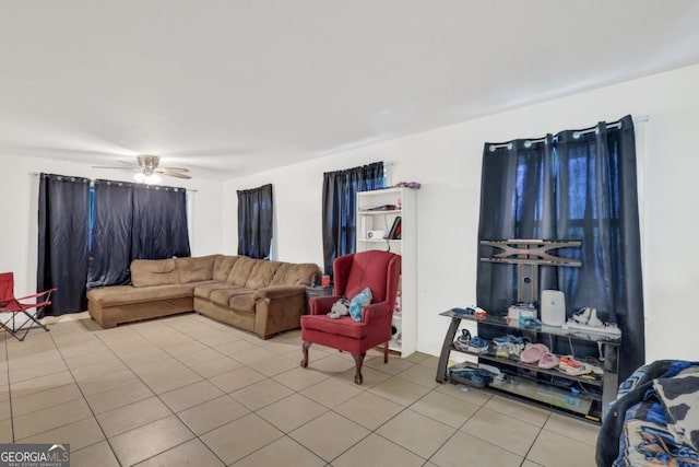 tiled living room with ceiling fan