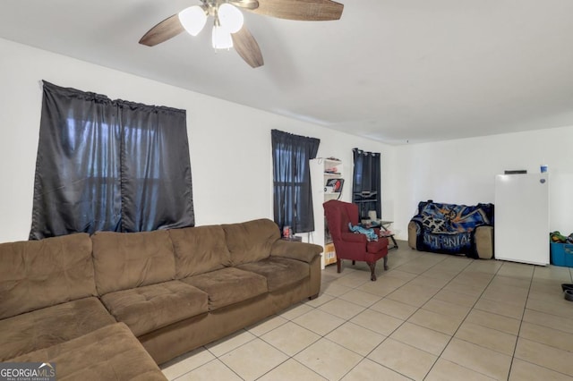 tiled living room featuring ceiling fan