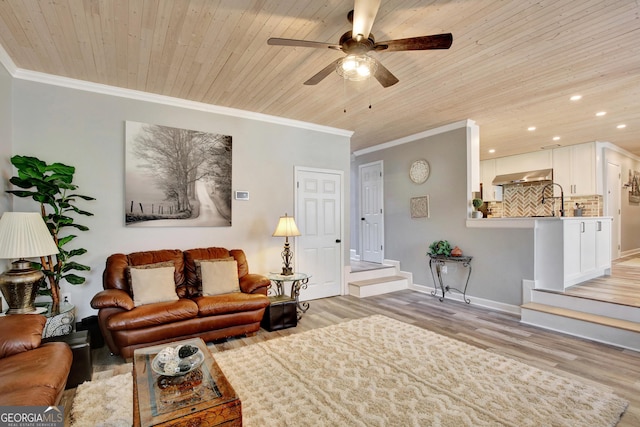 living room featuring crown molding, light wood-type flooring, and wooden ceiling