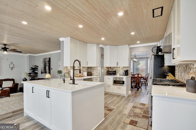 kitchen with an island with sink, white cabinets, wood ceiling, light hardwood / wood-style floors, and crown molding